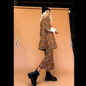 Dressed in LALA Lex ribbed Playsuit in Leopard